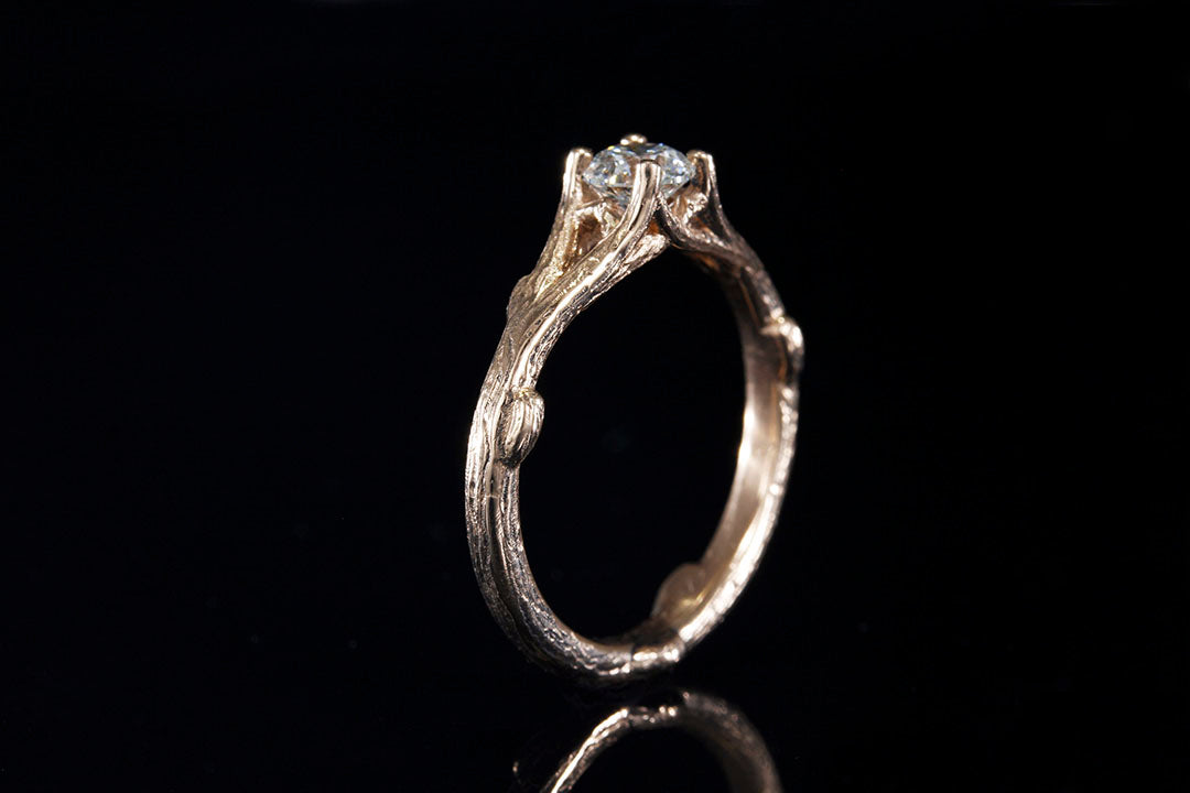 Rose Gold Tree Bark Pattern Ring Standing upright hold a 4mm 1/4 carat clear diamond