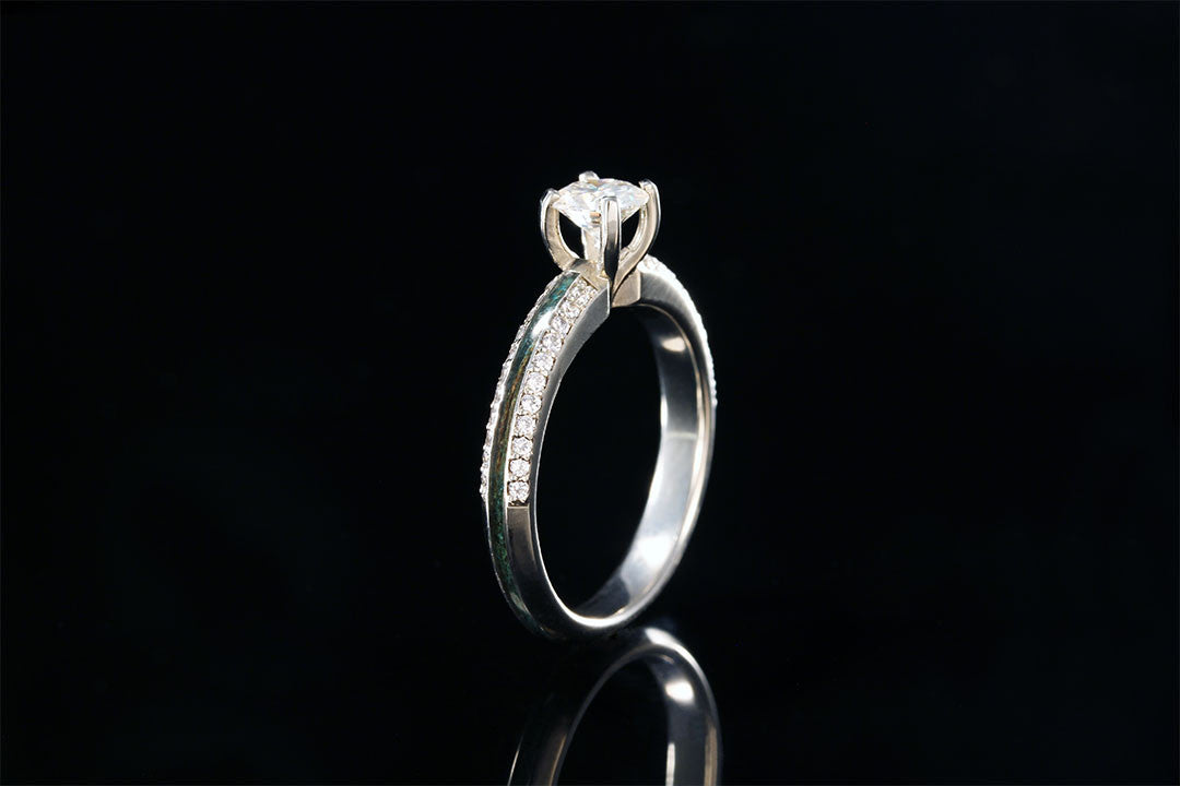 gold and diamond ring, upright view, silver inner band, blue dyed acrylic wood knife edge