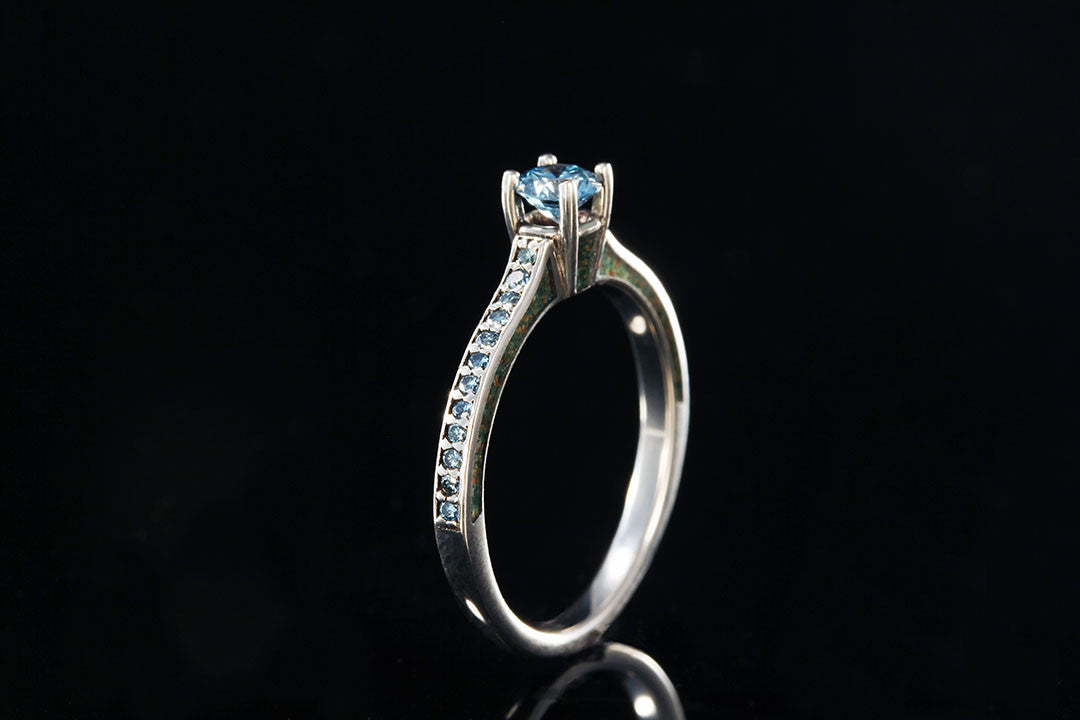 Diamond Engagement ring, upright view, silver inner band, aqua blue diamonds, Chasing Victory