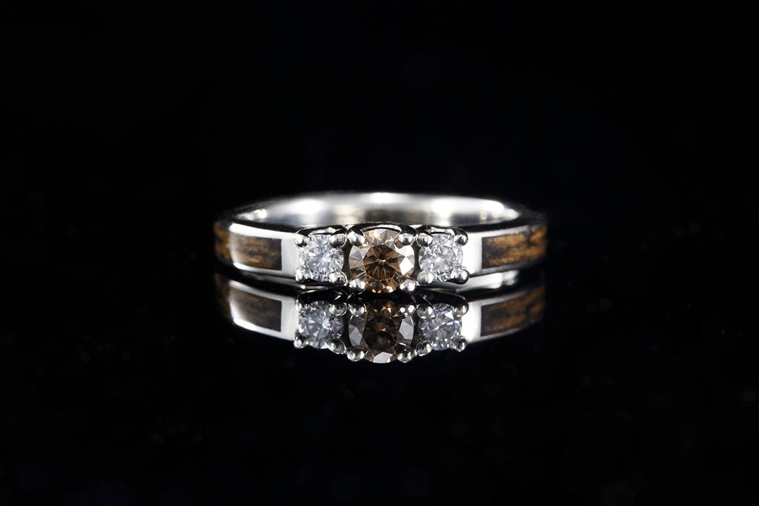 A 3-stone Whiskey Barrel Wood Engagement ring, brown center diamond flanked by two white diamonds