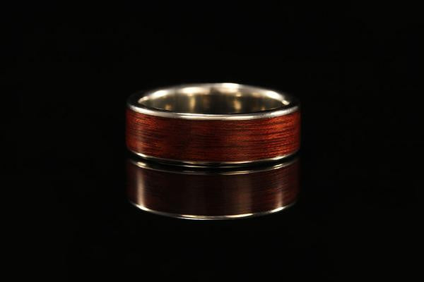 A wood band with white gold for men, dark wood, golden inner band