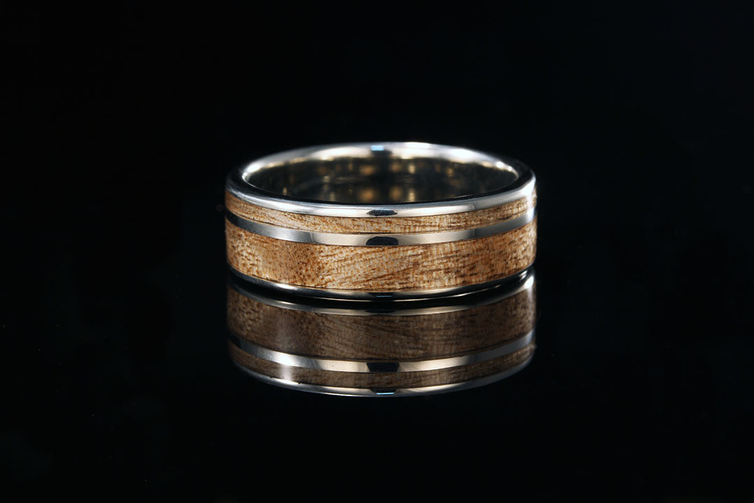 Wood and titanium ring with black background