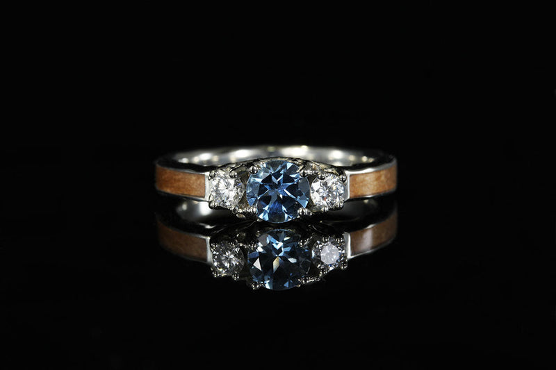 3 stone "Coral of the Sea" engagement ring, front view, blue and white diamonds 