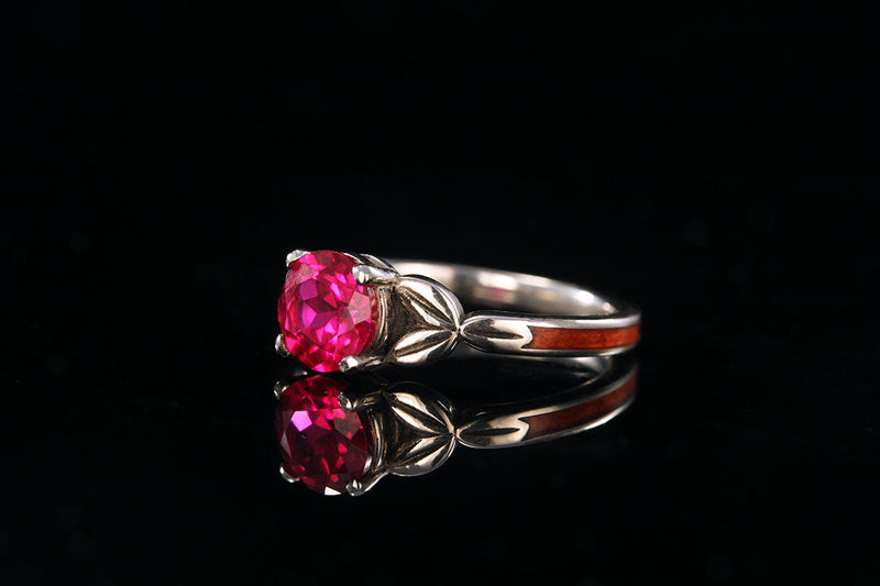 Redheart ruby leaf ring, side view, light wood band