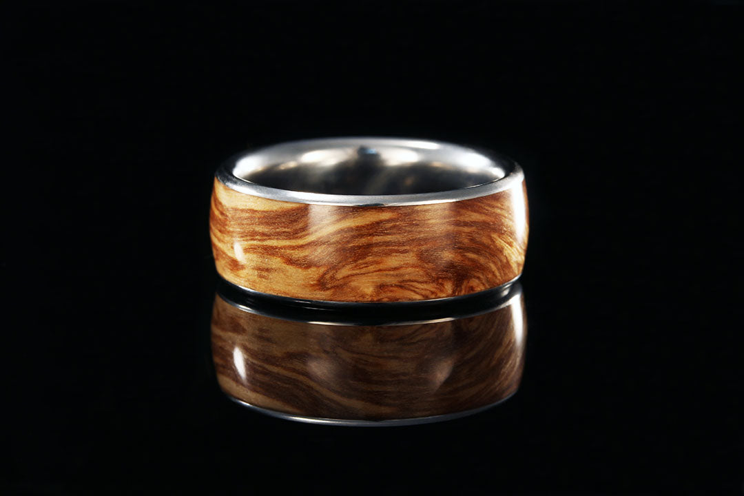 Bethlehem Olive Wood Ring, Chasing Victory. silver inner band
