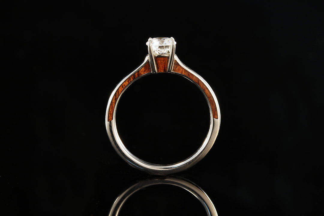 Gold and wooden ring upright view, white diamond