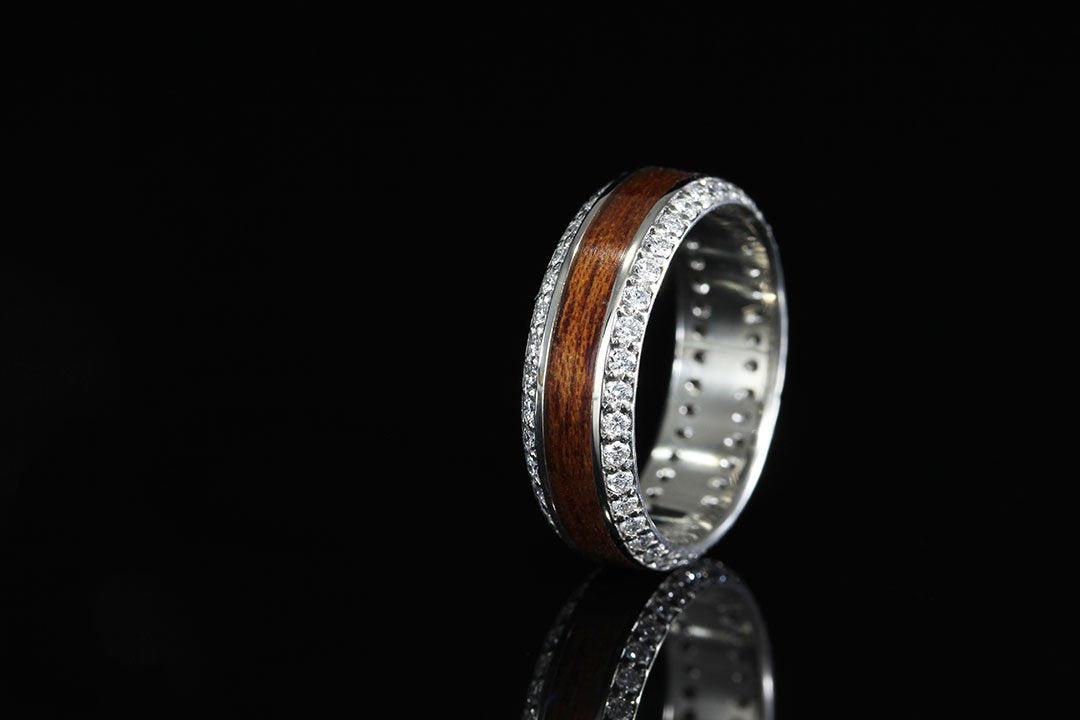 Diamond Ring with black background, upright view, silver interior band
