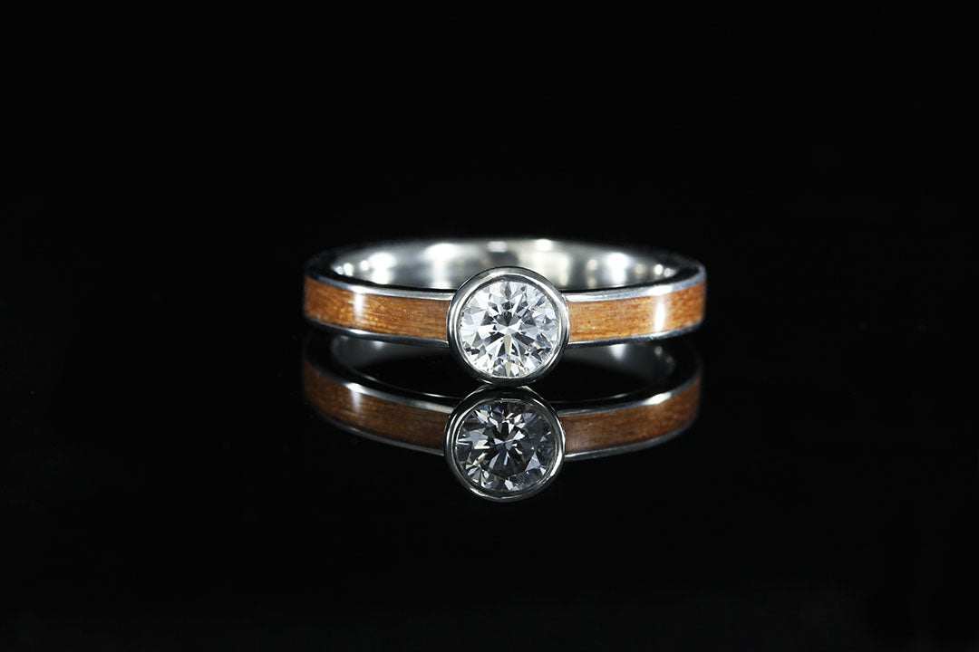 Image of women's wooden engagement ring, cherry wood ring with diamonds, light wood, single diamond, 14K Gold Bezal Set