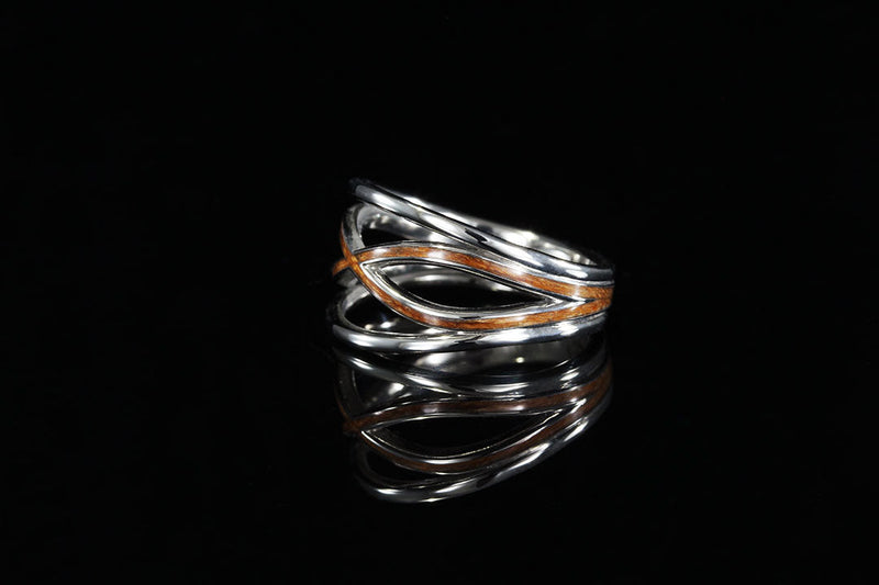 wood ring with a black background, side view, Silver and wooden infinity band, wedding ring