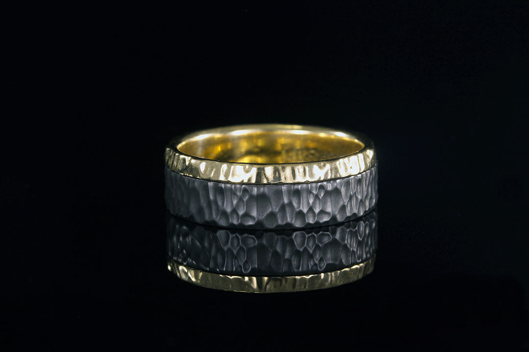 Textured black Zirconium and yellow gold edge ring, Chasing Victory, golden interior band