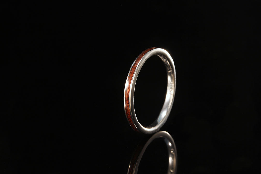 Upright view of a white Gold wood ring, Koa wooden round ring, Hawaiian ring